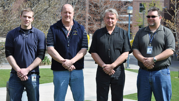 New Security Communications Coordinators (from left to right): Troy Campbell, Marty Schneider, Bill Petrie and Brad Haberstock. Missing from the photo is Matt Leibel.