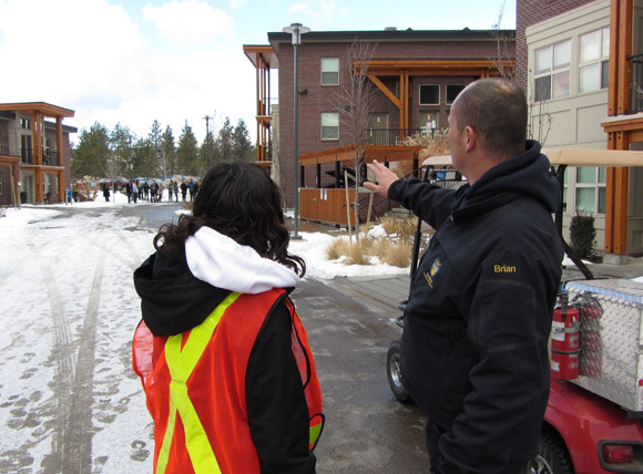 Fire, Life and Safety Technician Brian Toering discusses fire drill evacuation procedures with Residence Life staff.