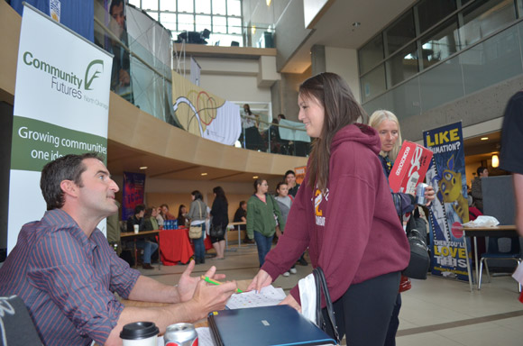 Mike Champigny, of North Okanagan Community Futures, answers questions from Fulton Secondary student Shade Alexis
