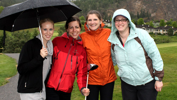 Despite a slight drizzle, Team Four were all smiles at the 6th Annual UBC Hack and Whack Golf Tournament at the Gallagher's Canyon Golf & Country Club.  Team members included, left to right, Breanne Molnar, Kaliopi Kollias, Jamie Frezell and Jessica Davidson.