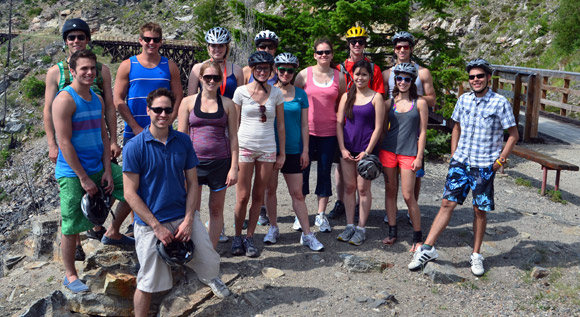 Participants in the mountain biking adventure to Myra Canyon stop for a group photo