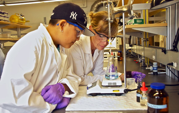 Student Wyatt Dubrett, left, and UBC Lab Technician Michelle Tofteland check out water samples from Kalamalka Lake during the engineering and environmental studies workshop.