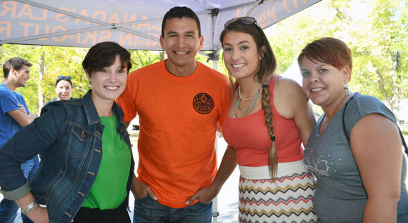 UBC students Kelly Panchyshyn, left to right, Elora Bascello and Mary Song jumped at the chance to be photographed with the charismatic Wab Kinew at the Okanagan Nation Alliance Salmon Feast in Okanagan Falls.