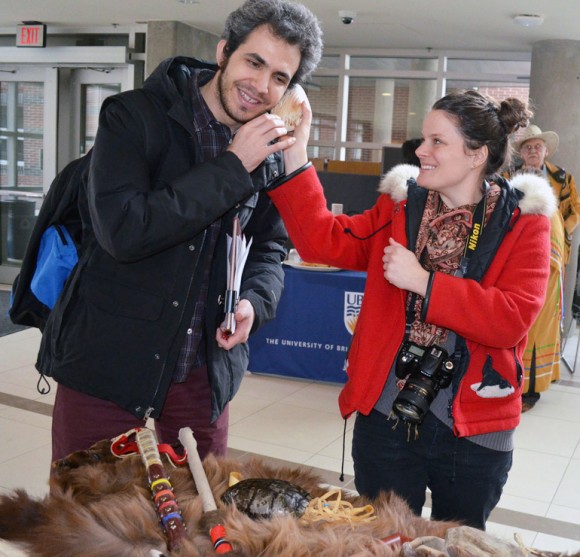 Equity and Inclusion Office Educator Jenica Frisque enjoys the many Métis artifacts with student Amin Mansouri.