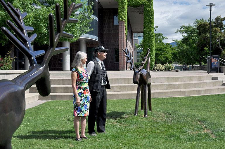 Louise Sidley, left, and David Sidley with the sculpture “Pair of Deer.”