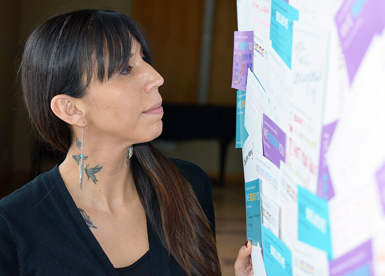 Bachelor of Art student Jamie Stimson reflects on the words of encouragement posted on a sign during a Sexual Assault Awareness Month (SAAM) event in January. Later this month, Stimson will be a featured speaker at the In Honour of Missing and Murdered Indigenous Women event in the UNC ballroom.