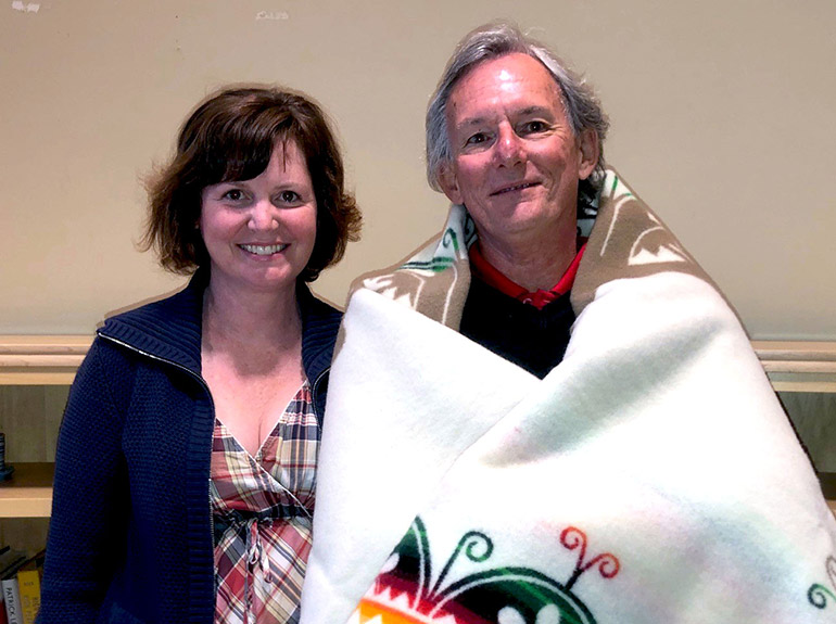 On behalf of UBC Okanagan, at the Aboriginal Advisory Council meeting on June 8,  Laura Cull presented husband Ian Cull with a commemorative Creation Turtle blanket. 