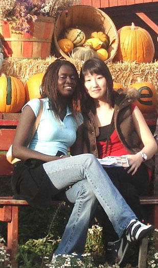 International students Saddy Njie from the  Gambia and Jane Lee from South Korea enjoyed a weekend  with a Vernon family this fall. Their homestay through  the Vernon Rotary Clubs included a visit to Davison Orchards, a traditional Okanagan family farm.