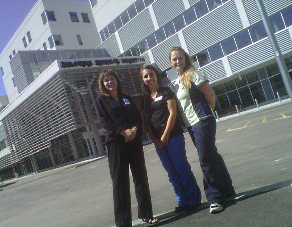 Kelowna General Hospital Administrator Tracy MacDonald and UBC nursing student Samantha Waller and Jennifer Jabs, outside the new Centennial Building. The students and their classmates will be helping out with moving patients into the new facility this Sunday.