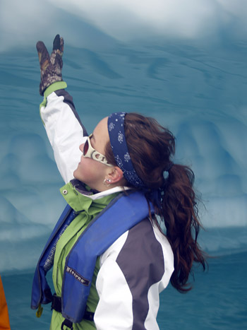 Jenna Gall, a third-year environmental science student at UBC's Okanagan campus, touches an iceberg for the first time during a trip to Antarctica.