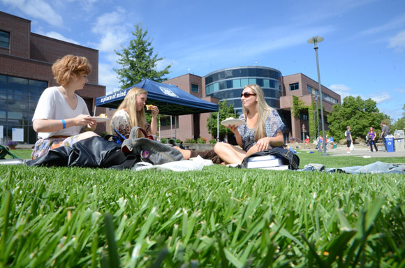 Students enjoy a break on the campus courtyard at UBC