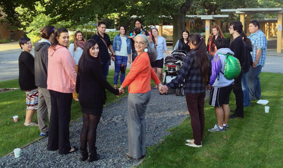 UBC students Carla Miles (pink sweater) and Crystal Prince are joined by Assist. Prof. of Indigenous Studies Margo Tamez (orange sweater) and other UBC students in a prayer circle Wednesday morning prior to attending the Truth and Reconciliation Commission’s national event in Vancouver.