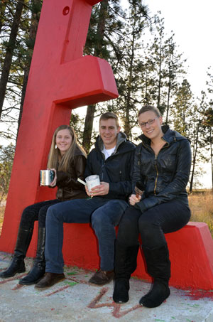 Engineering students Tia Haunts, Will Patterson, and Heather Mallory are ready to paint the iconic red E white, so participants in the memorial service next week can then write messages of hope and inspiration onto the E.