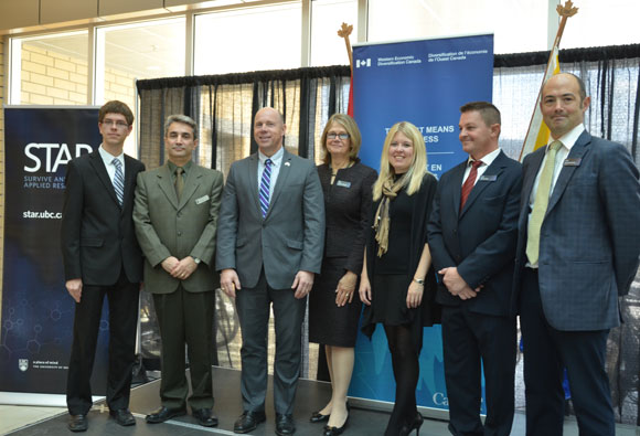 At the announcement Tuesday morning, from left, UBC undergraduate student researcher Ephraim Nowak; Assoc. Prof. Homayoun Najjaran; Kelowna-Lake Country MP Ron Cannan; UBC Deputy Vice-Chancellor Deborah Buszard; Michelle Rempel, Minister of State for Western Economic Development; Phil Lancaster, Founder and President of Helios Global Technologies; and UBC Okanagan Vice-Principal Research Prof. Gord Binsted.