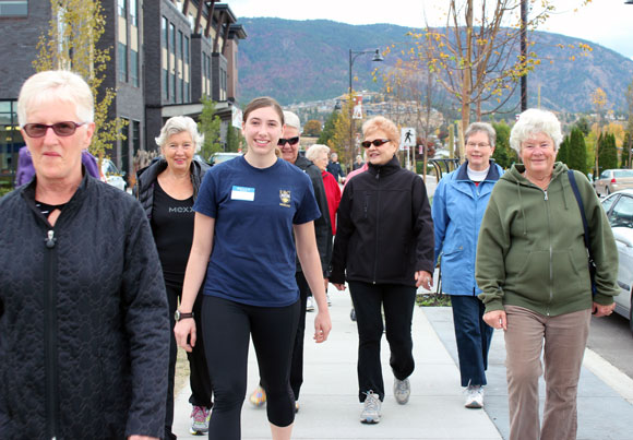 UBC Southern Medical Program student Celine Akyurekli (centre) leads a walk around the block with Walk n’ Talk for Your Life participants in West Kelowna.