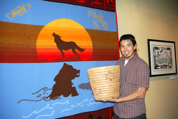 UBC graduate Jordan Coble, with Westbank First Nation art that he curates as curatorial and heritage researcher for the Sncəwips Heritage Museum.