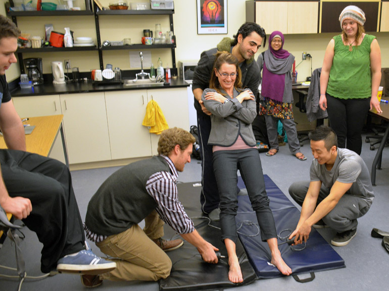 UBC Asst. Prof. Jennifer Jacoki and students in a physiology demonstration during Celebrate Research Week 2014.