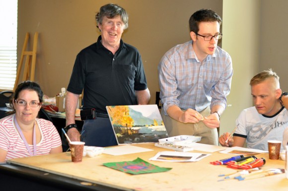 UBC Okanagan medical student Maksim Parfyonov, second from right, leads the weekly art class with Connect residents Amadee Hollowink, Glen O’Connor, and Matthew McKay.