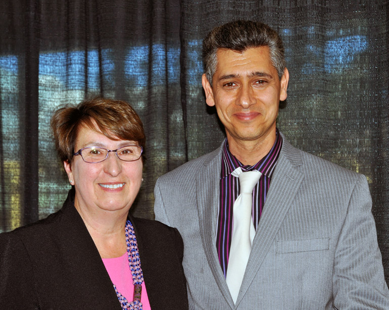 Provost and Vice-Principal Cynthia Mathieson presents engineering instructor Ray Taheri with the junior faculty Award for Teaching Excellence and Innovation