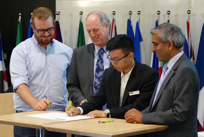 Historic first signatures are added to the Okanagan Charter at UBC Okanagan Thursday afternoon. From left, Tom Macauley, President of the UBC Students’ Union Okanagan, Jim Hamilton, President of Okanagan College, Enoch Weng, President of the Simon Fraser University Student Society, and Arvind Gupta, President of UBC.