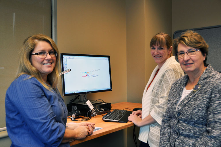 Earllene Roberts, with UBC Okanagan’s Disability Resource Centre, and Barbara Sobol, undergraduate services librarian, demonstrate some of the equipment available at the campus’s new Inclusive Technology Lab to Provost and Vice-Principal Academic of the Okanagan campus Cynthia Mathieson (right). 
