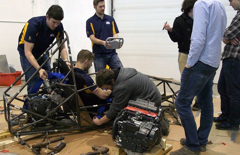UBCO's Motorsports team prepares their car for the road ahead. 