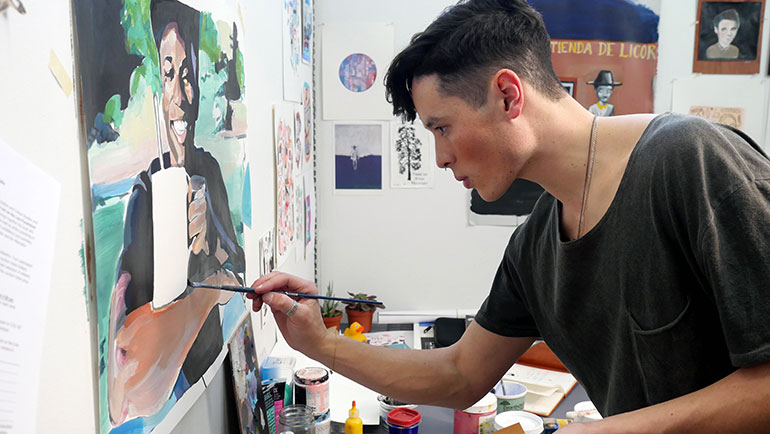 Bachelor of Fine Arts student Ben Arcega works on a painting in his studio. Ben’s work is part of the BFA graduation exhibition taking place at UBC starting on April 13.