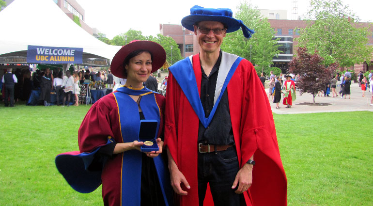 Newly-minted PhD grad Walaa Moursi and her PhD supervisor Professor Heinz Bauschke celebrate her Governor General gold medal award.