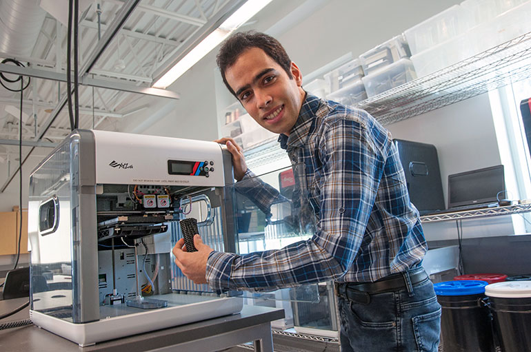 Hossein Montazerian, research assistant with UBC Okanagan’s School of Engineering, demonstrates the artificial bone design that can be made with a 3D printer.