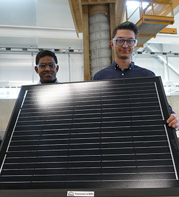 Engineering graduate students Tharaka Wanniarachchi and Remy Kennedy-Kuiper are working on a system to keep solar panels clear of ice and snow so they work effectively during winter months.