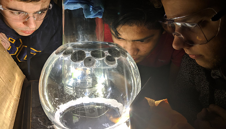 A team of students from UBC Okanagan with a prototype 'cloud chamber' that will be launched by high-altitude balloon and used to study cosmic particles in the Earth’s upper atmosphere in August.