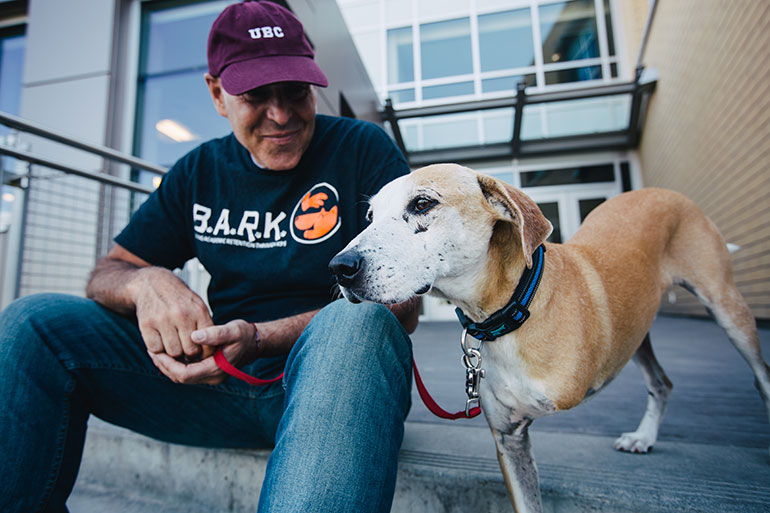 UBCO Associate Professor John-Tyler Binfet, whose research focusses on measuring kindness in schools, children and adolescents, practices what he preaches. Binfet poses with his new rescue dog Craig.