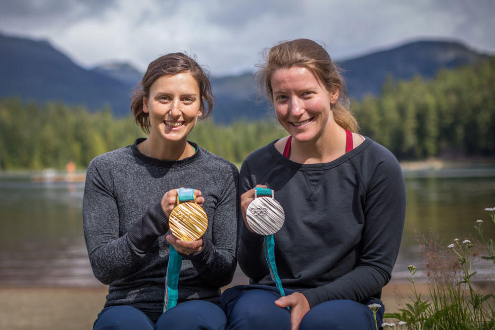 Kelsey Serwa and Brittany Phelan pose with their Olympics medals.