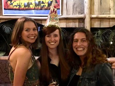 Willa Holmwood (centre) celebrating her birthday in Tanzania with roommates Adanna Farrow (left) and Arielle Shakour.