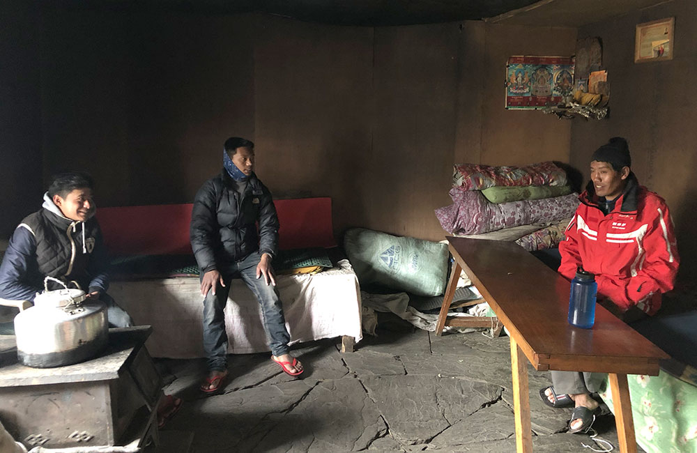 Three men in a Nepali guesthouse