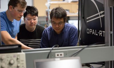 Professor Liwei Wang in his lab with students