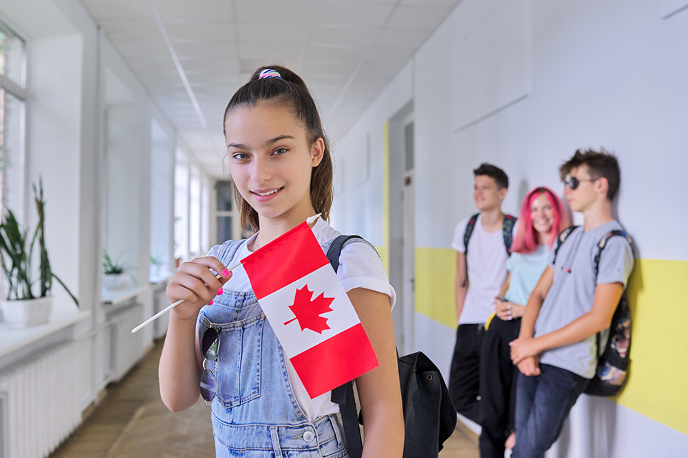student with Canadian flag