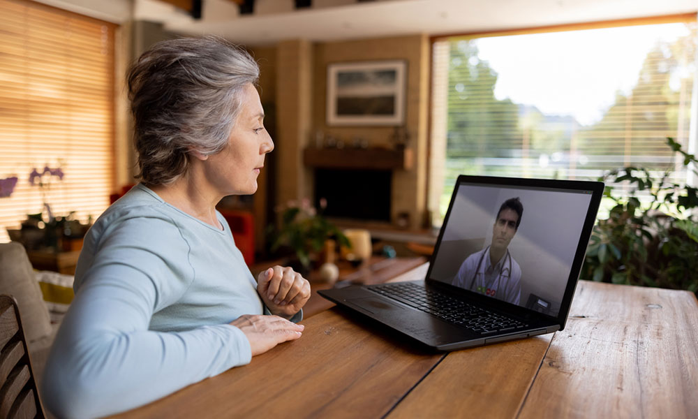A woman talking with a doctor virtually