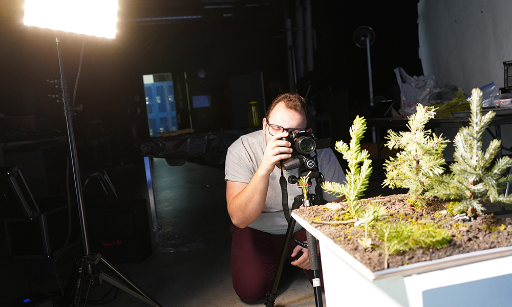 A photo of a student filmmaker working on a stop-motion project
