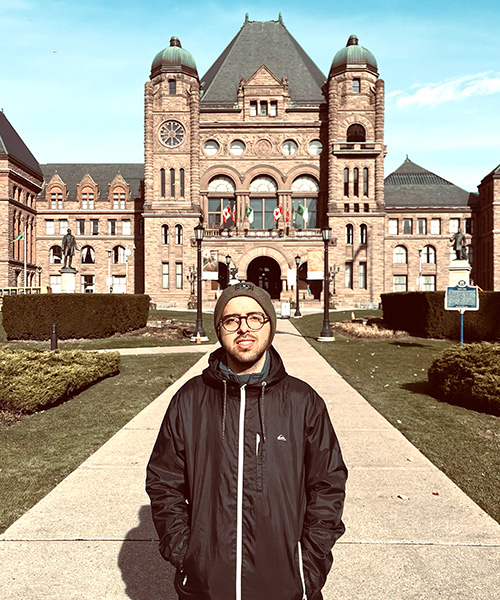 Mohammad Mosaffa in front of a legislature building