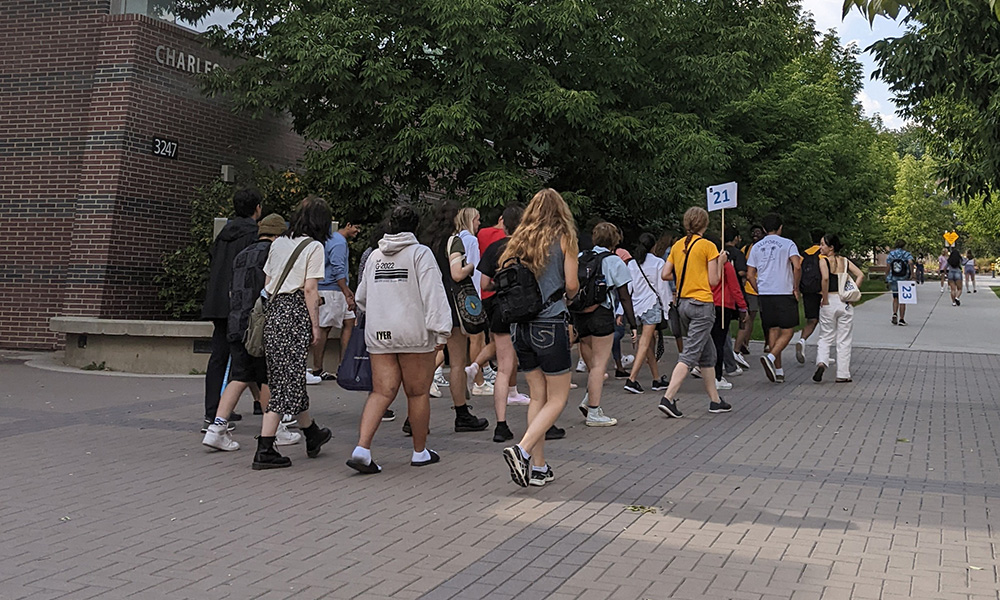 A photo of students walking towards orientation activities.