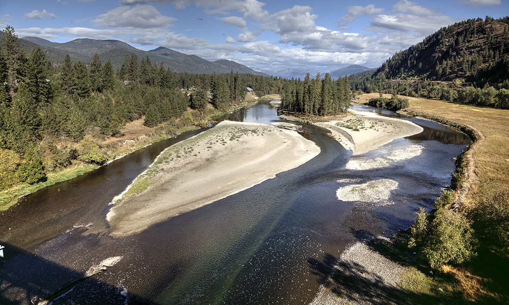 A section of the Kettle River is photographed from a bridge.