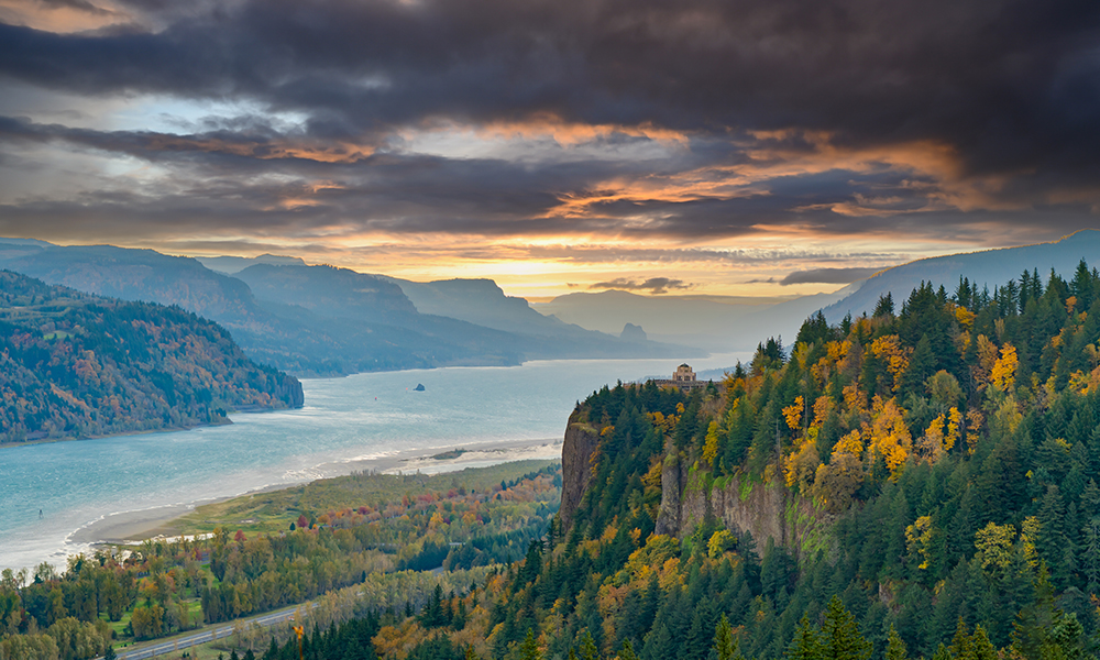 The sun rises over the Columbia River Gorge in the fall season, Oregon.